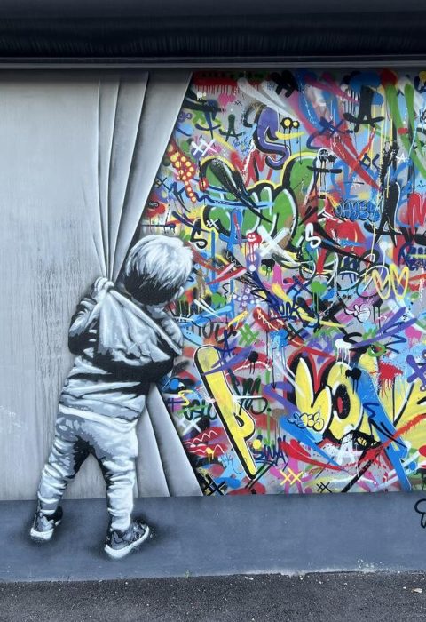 A mural at Wynwood Walls - Behind the curtain by Martin Whatson